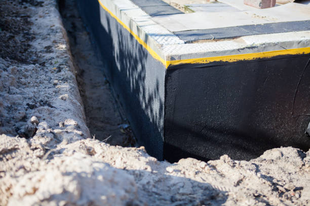 Professional Interior Drainage System technician working in Roann, IN